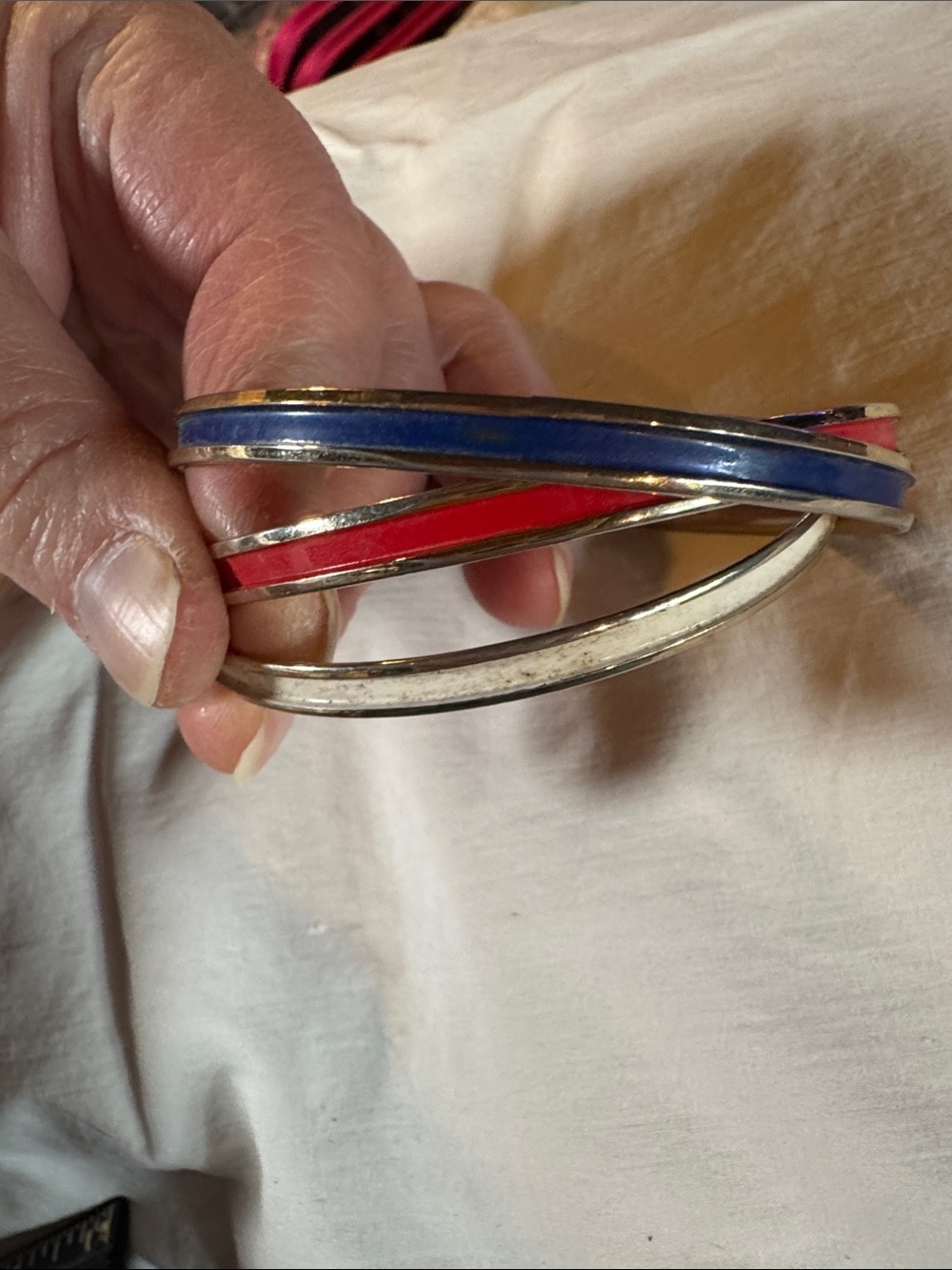 Napier Interlocked Goldtone Bangles with Red, White, and Blue Enamel Accents